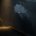 Huge dim reservoir: a dark silent torrent pours out through a breach in the wall, while from a small pipe on the opposite side a thin thread of glowing amber liquid trickles in, tiny by comparison